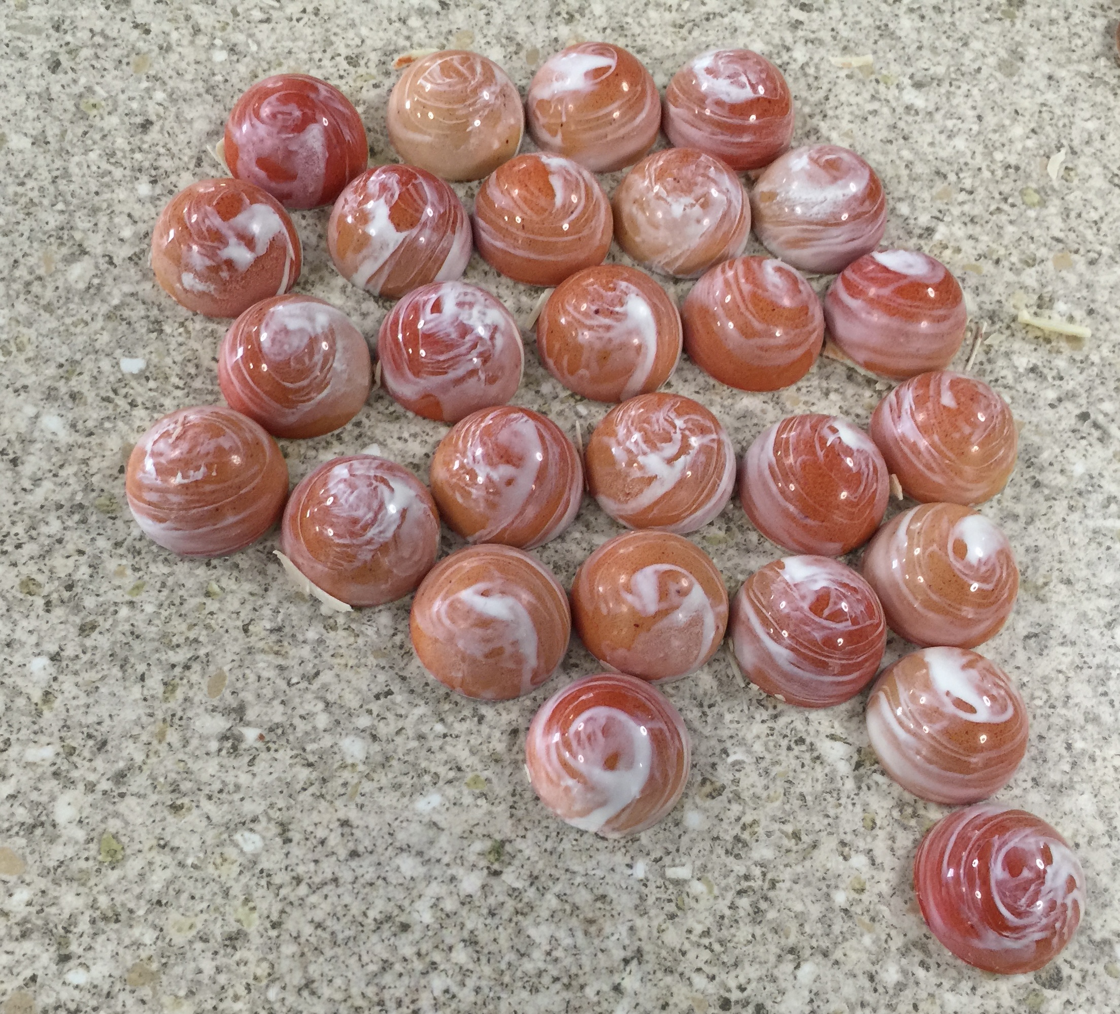 pink rhubarb truffles on marble slab